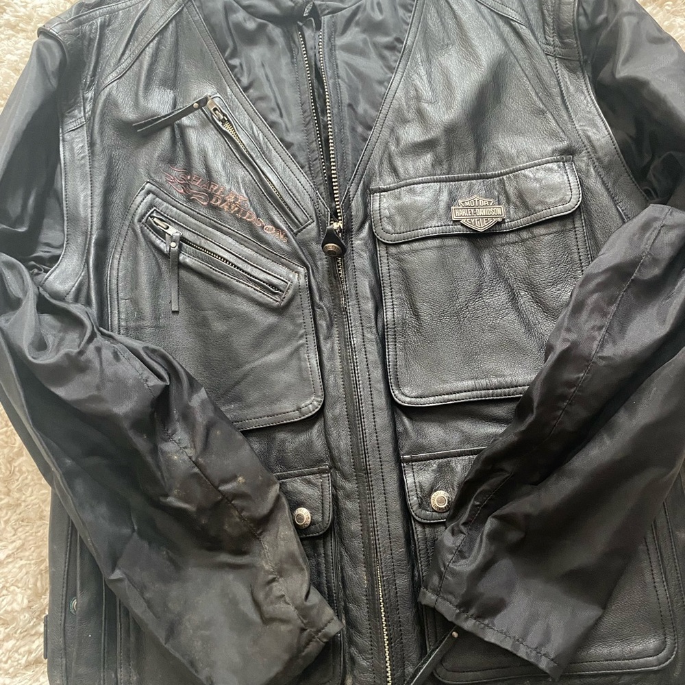 Harley Davidson leather jacket. Sleeves are a heavy windbreaker material.
